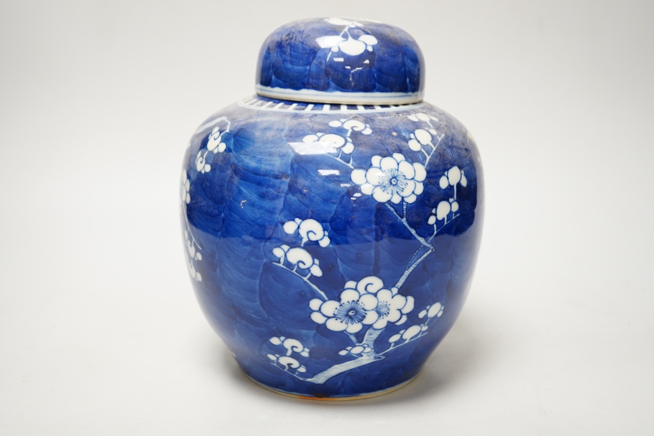 A 19th/20th century Chinese blue and white prunus jar and cover, 22cm